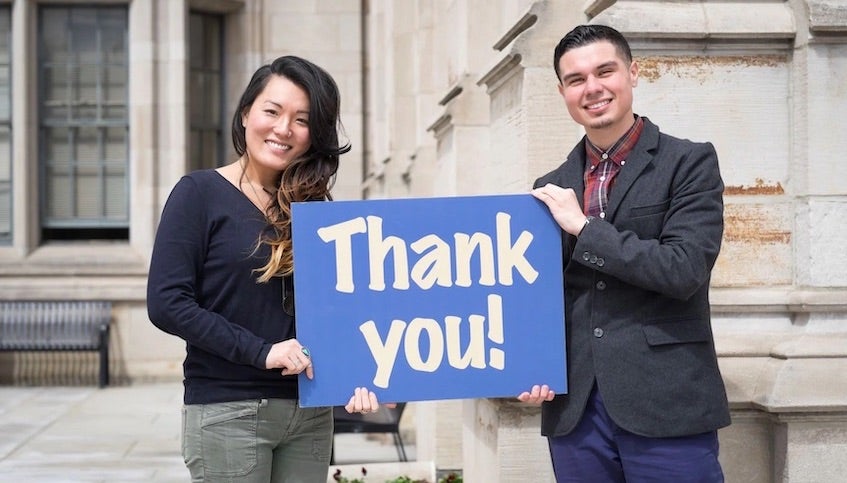 Students holding thank you sign