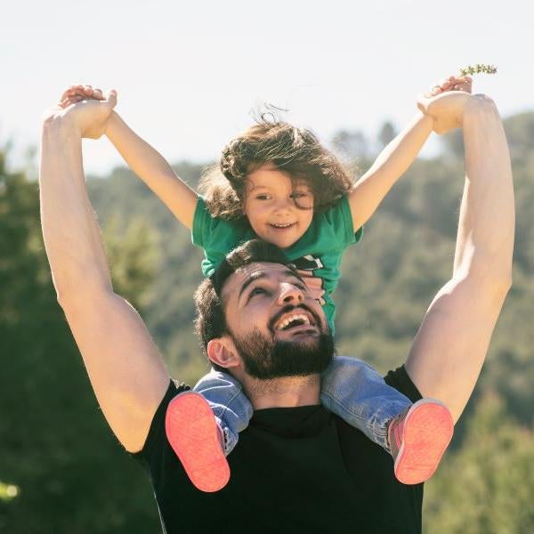 Father with child on shoulders