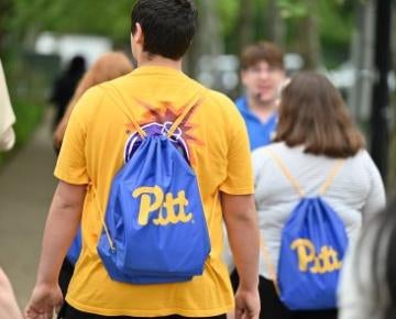 Students with Pitt backpacks