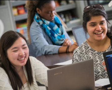 Pitt students interact in a classroom.